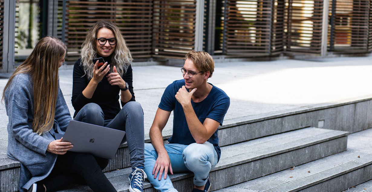 students sitting on stairs